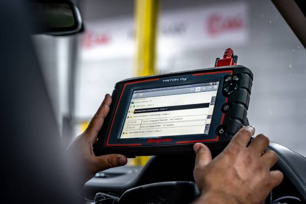A member of the TAC team working on a diagnostics